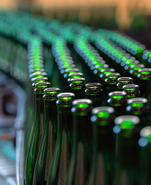 Stock imagery of green glass bottle stacked together