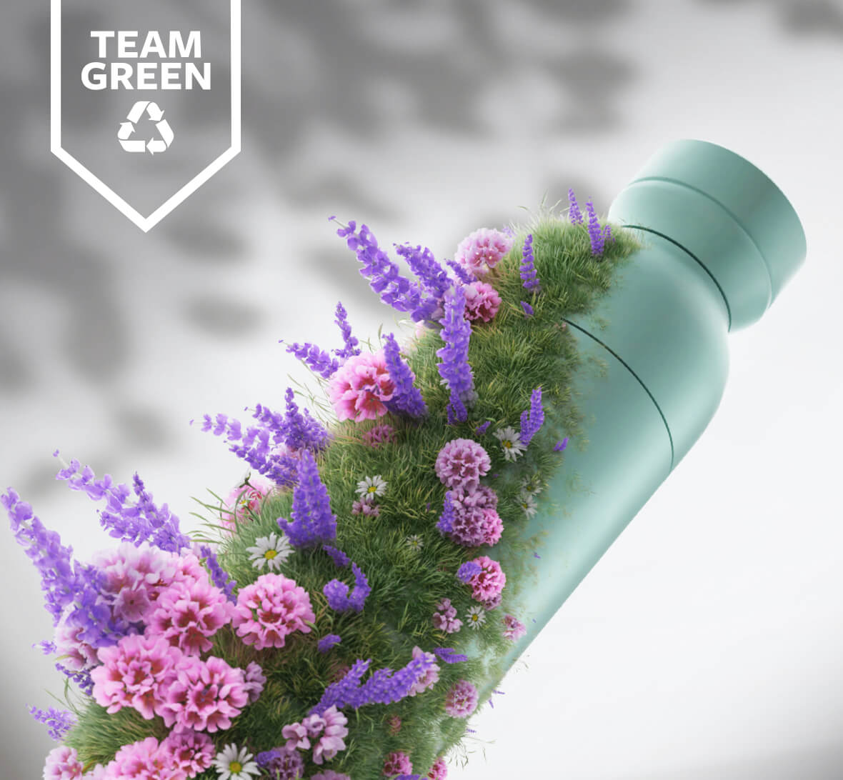 A a green plastic bottle with flowers growing on its surface. The Team Green logos is in the top left hand corner.